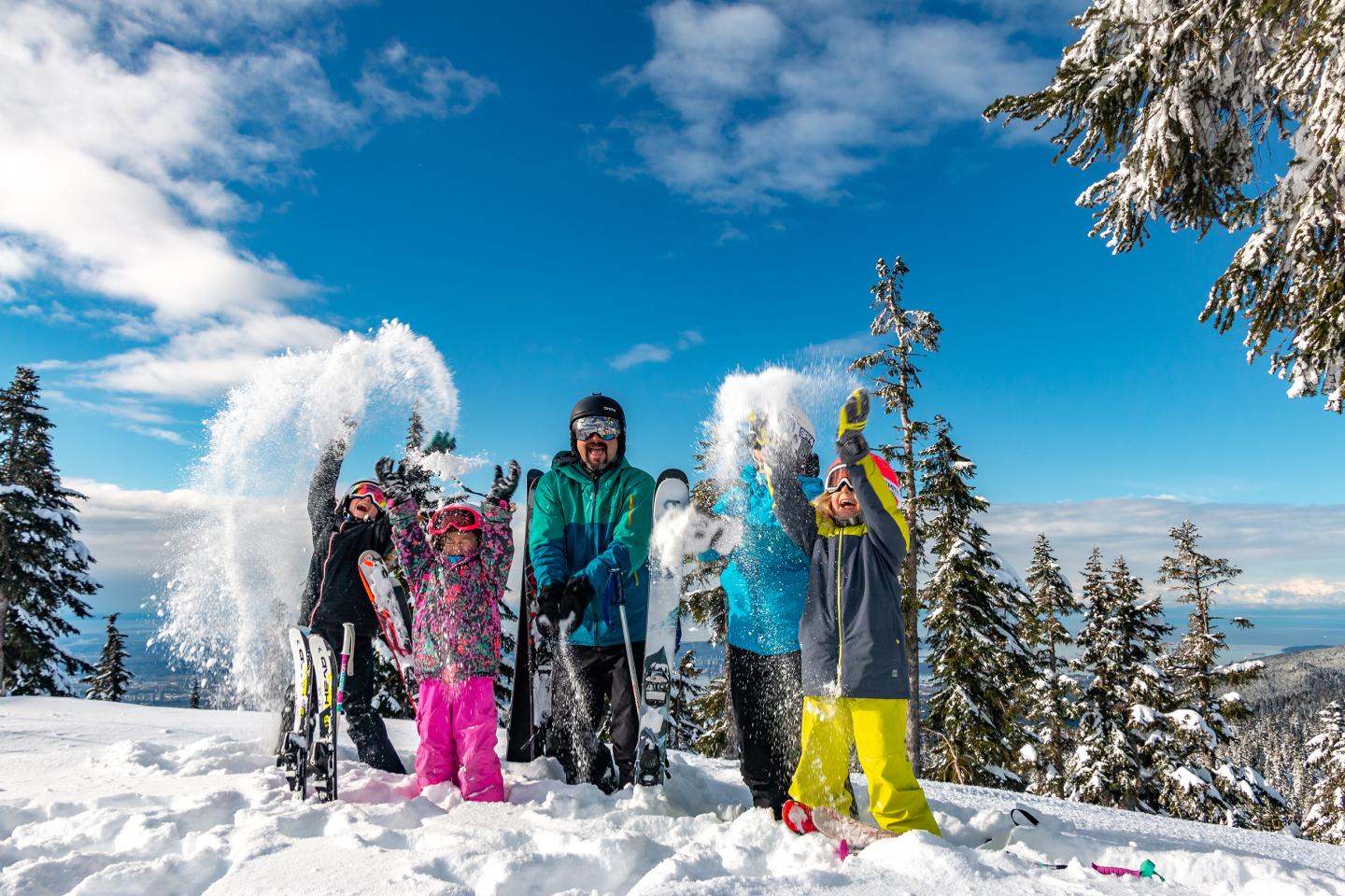 Family playing in the snow